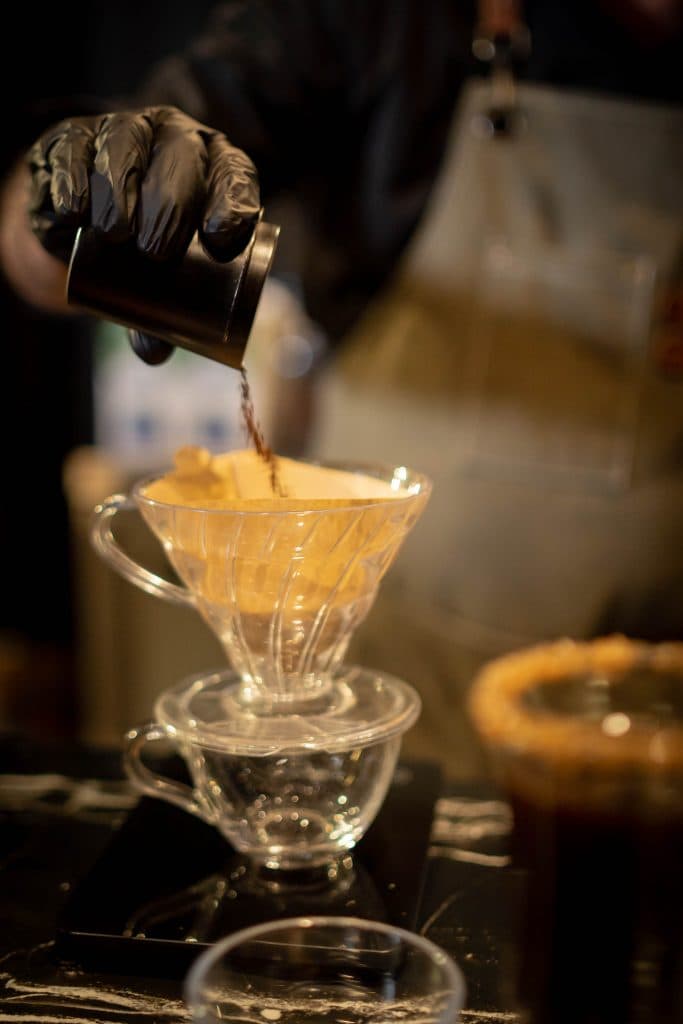Pour-over coffee being brewed at the bar